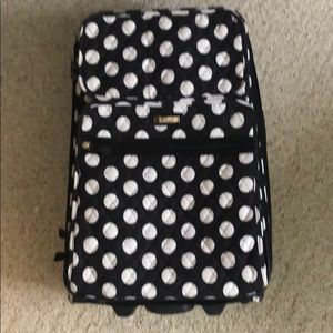 Black and white poka dot luggage bag